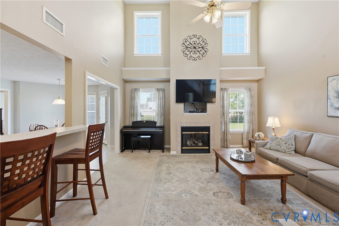 Gas fireplace framed by large windows creates a natural focal point Gas fireplace framed by large windows creates a natural focal point