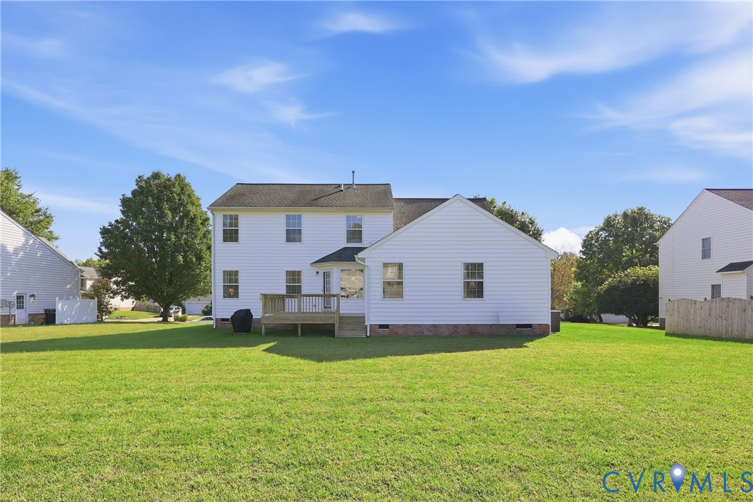 Broad backyard with meticulously maintained lawn
