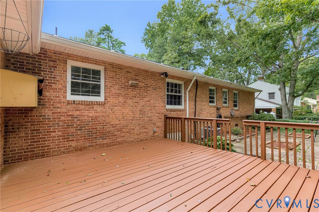 Spacious wood-finish deck with railing