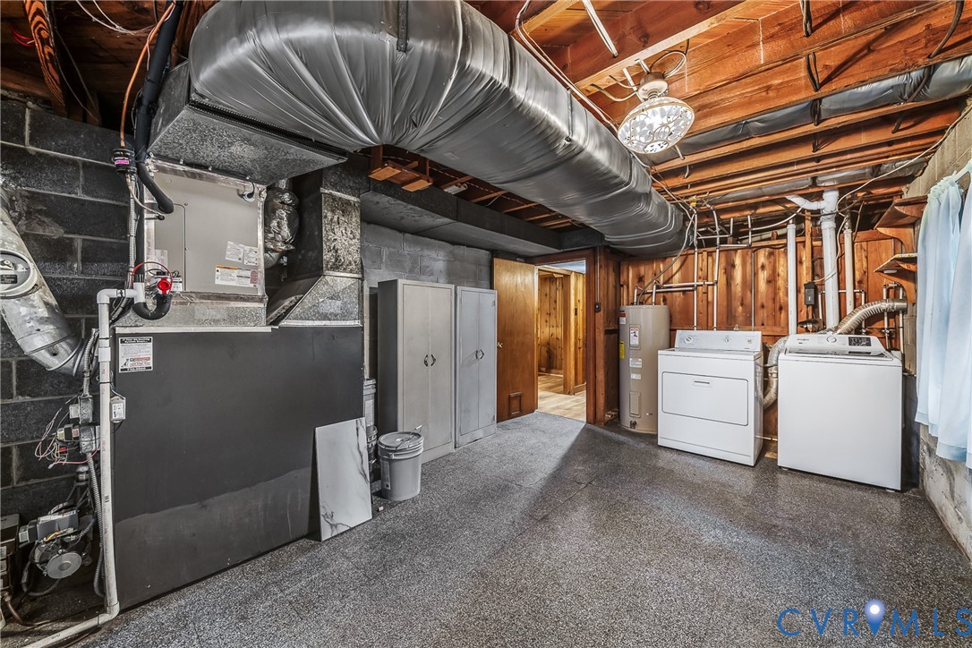 Exposed ceiling joists with ductwork, water heater, and mechanical systems