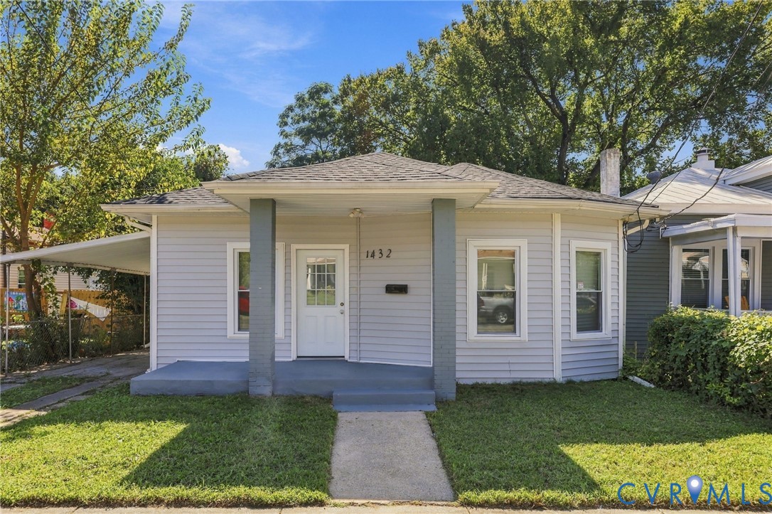 Light gray siding exterior with a dark gray shingle roof