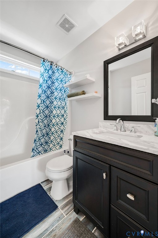 Vanity with dark wood cabinetry, white countertop, and rectangular mirror