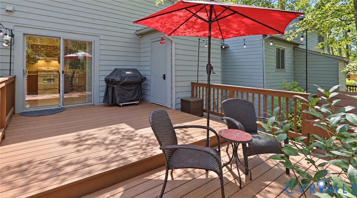 Multi-level outdoor deck featuring durable composite flooring and wooden railings