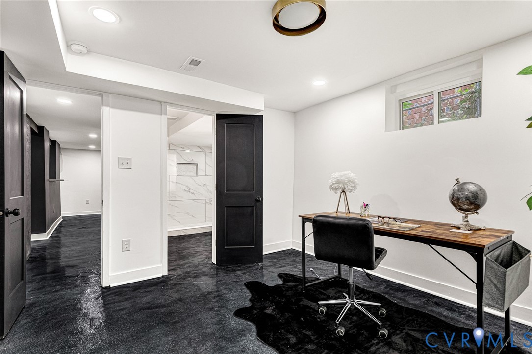 Recessed lighting, window with exterior exposure, and black interior doors