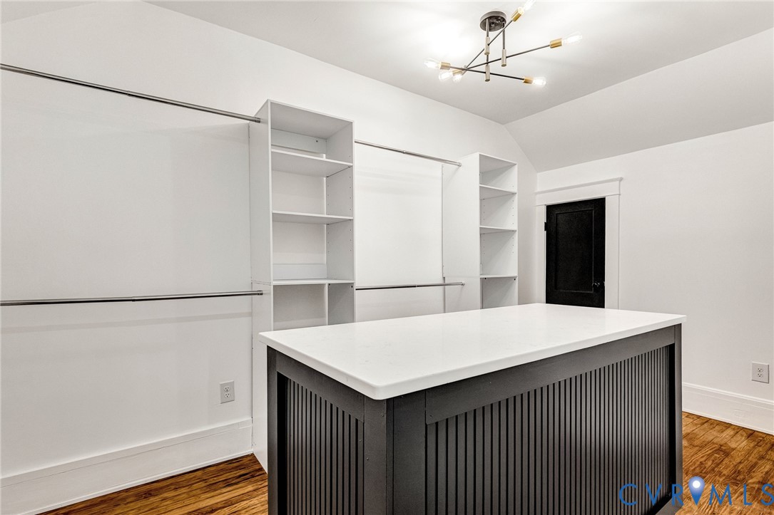 Custom closet island with a white countertop