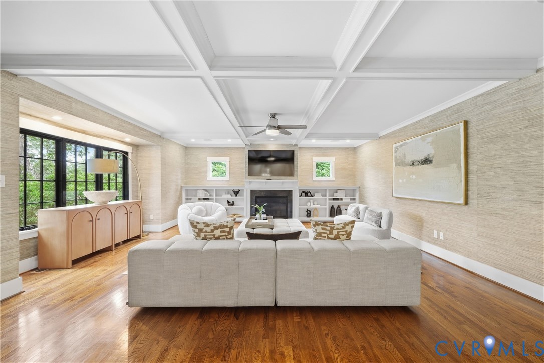 Recessed lighting, dark wood-finish flooring, and a coffered ceiling Recessed lighting, dark wood-finish flooring, and a coffered ceiling