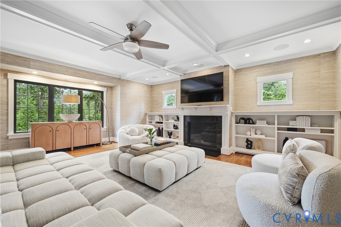 Coffered ceiling with recessed lighting and a ceiling fan