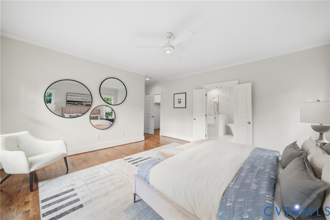 Hardwood flooring, crown molding, ceiling fan, and white walls