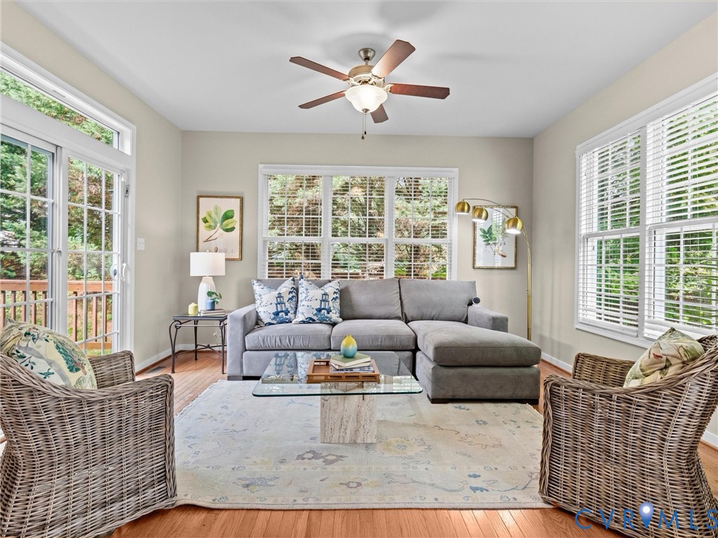 Hardwood flooring, recessed lighting, and a ceiling fan with light fixture