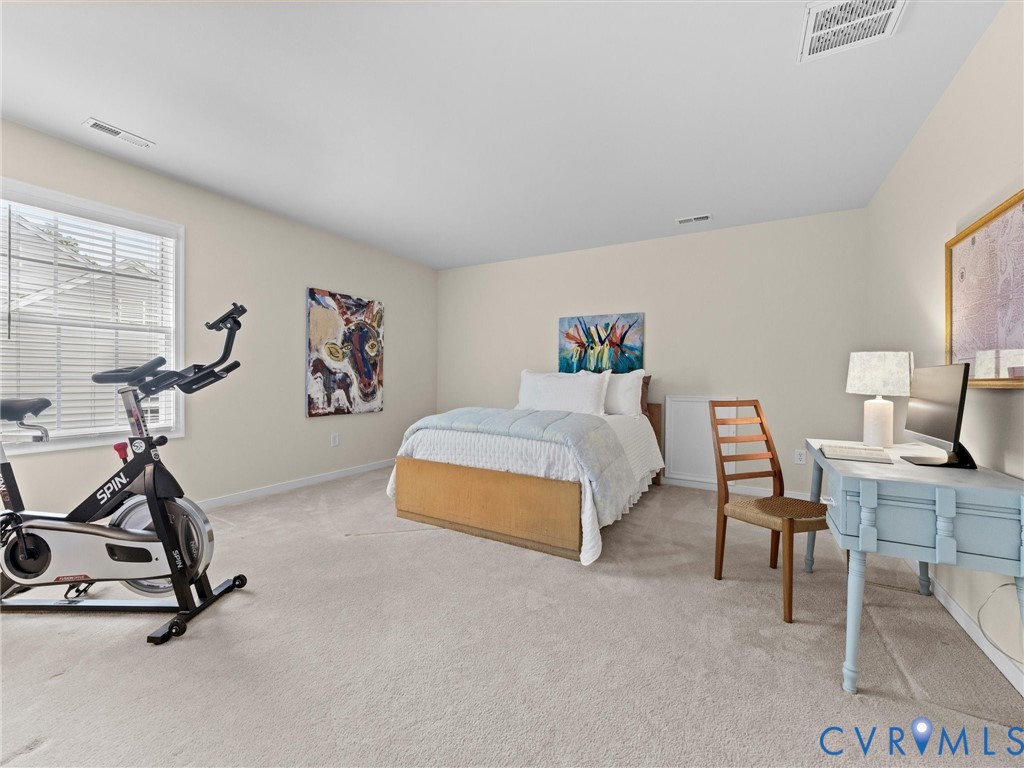 Carpeted flooring, neutral wall tones, window with blinds, recessed lighting
