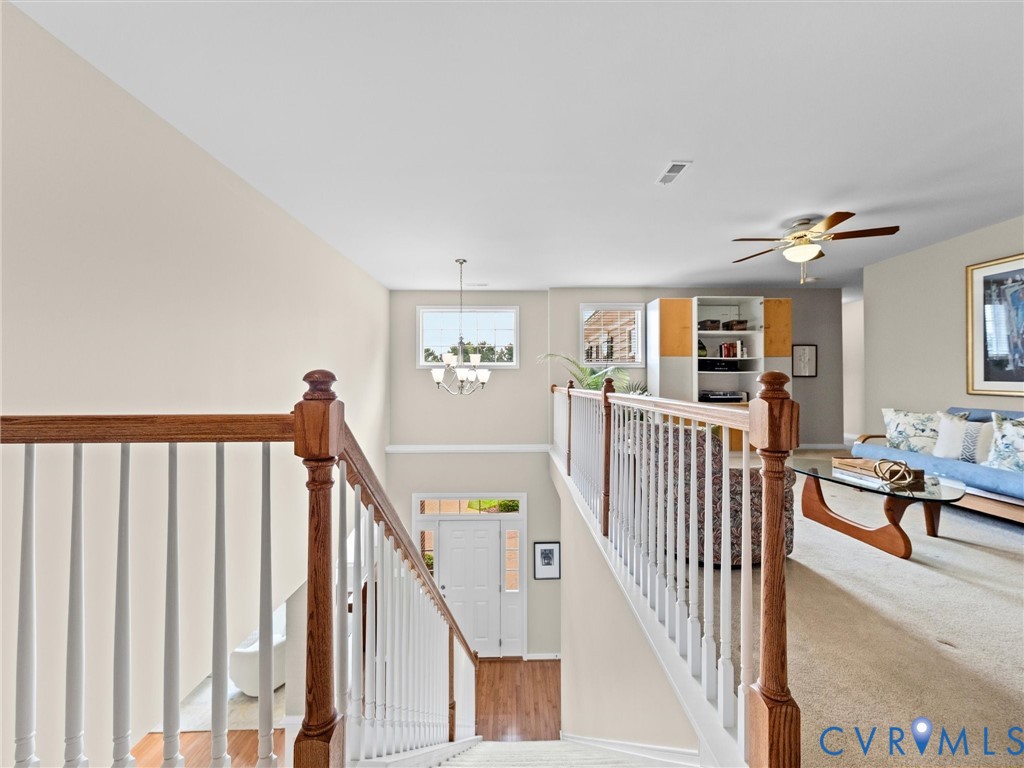 Two-story entry with wood-finish flooring