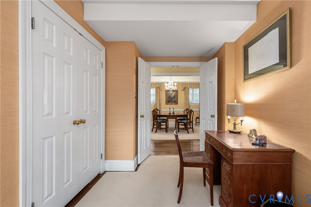 Textured wallpaper, double-door storage closet, and recessed double-door entry
