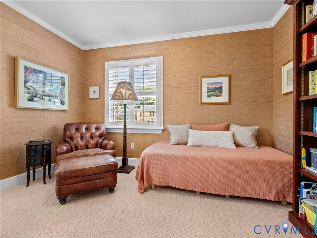 Crown molding, textured wall coverings, plantation shutters, and light-toned carpeting