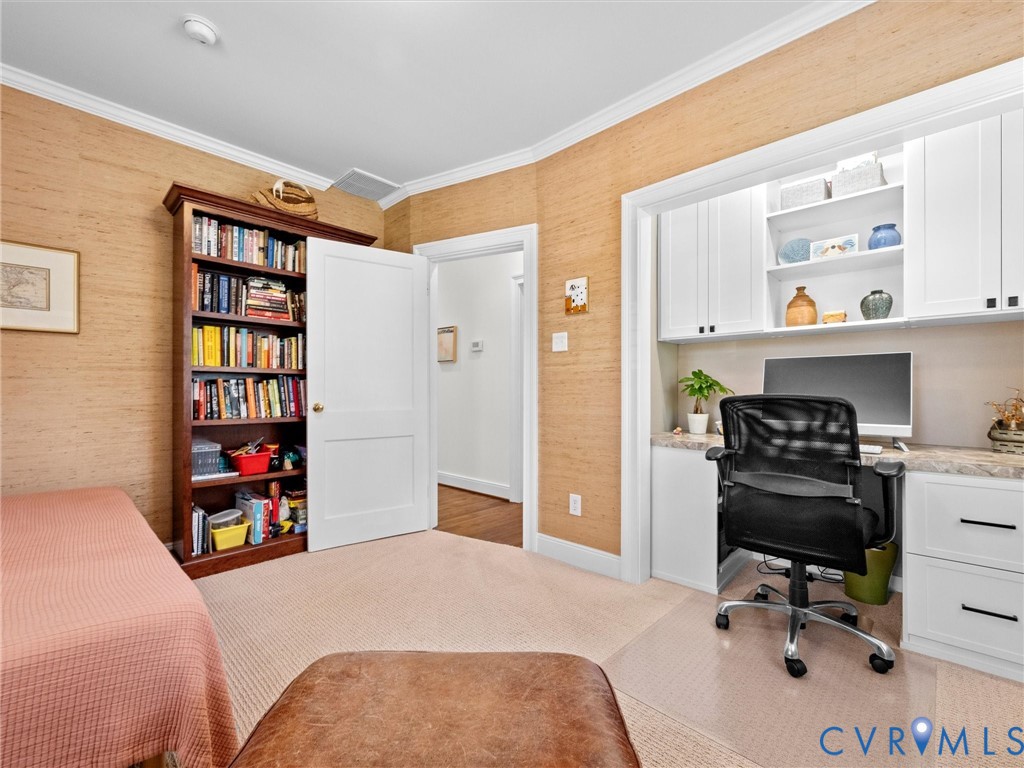 Built-in desk with overhead cabinetry, recessed lighting, and a countertop