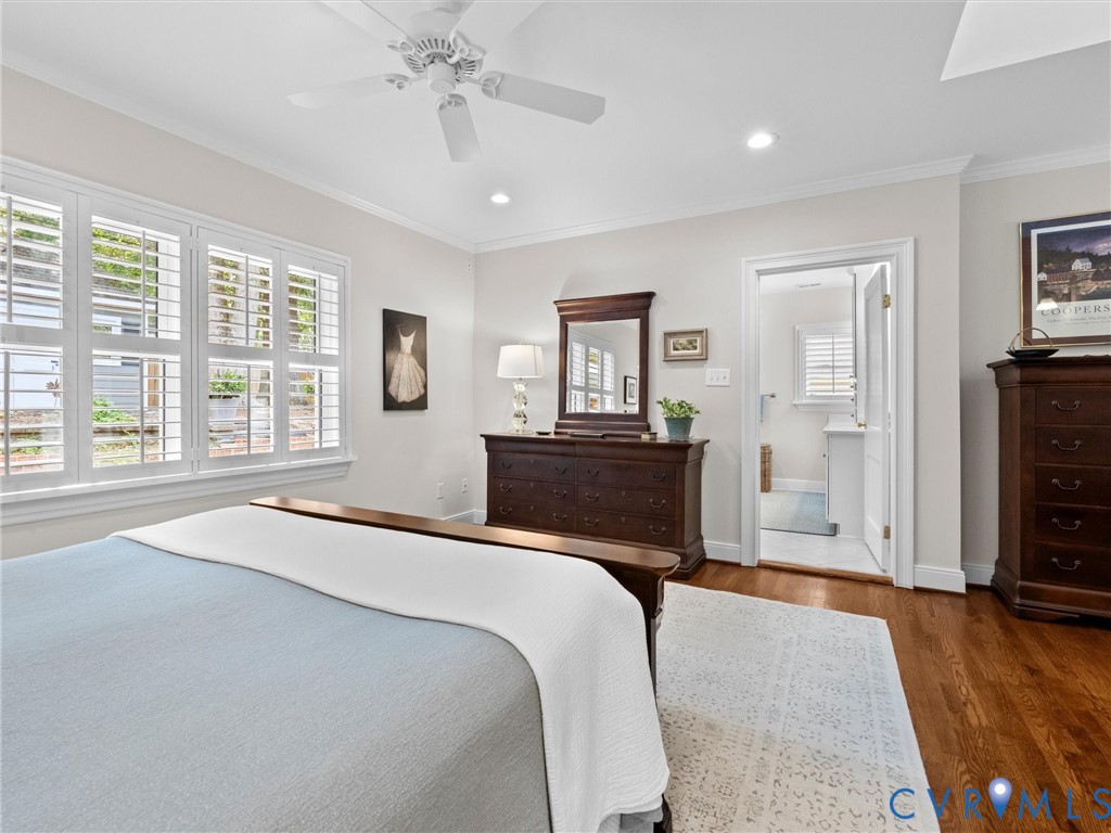 Hardwood flooring, recessed lighting, and a ceiling fan