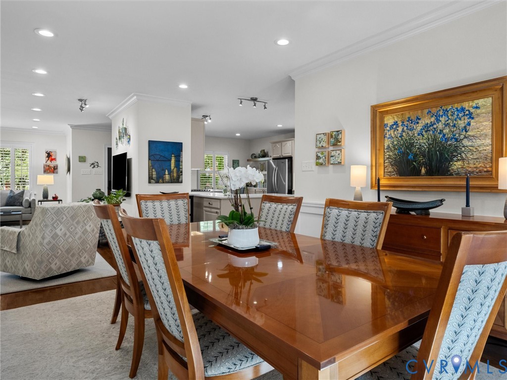 Recessed lighting, crown molding, and wood-finish flooring