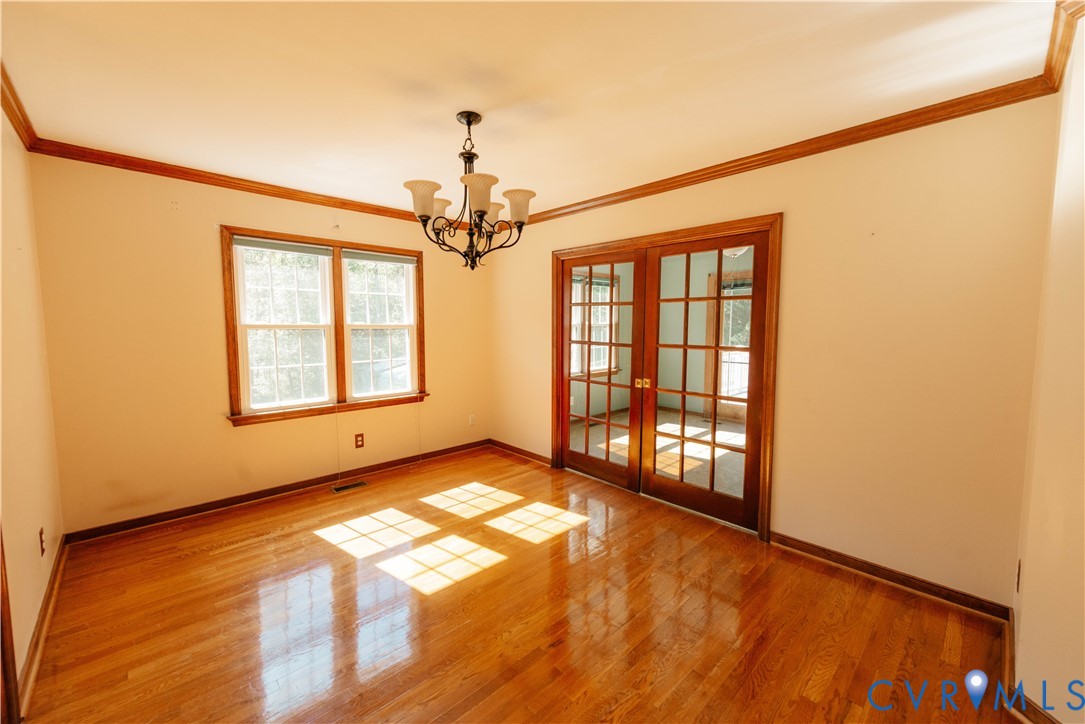 Dining Room with hardwood floors and pocket doors to Breakfast Room Dining Room with hardwood floors and pocket doors to Breakfast Room