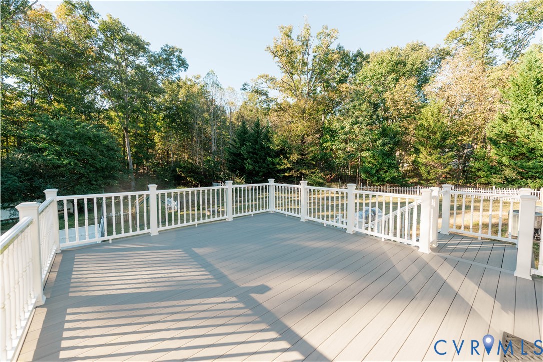 Deck overlooks private backyard