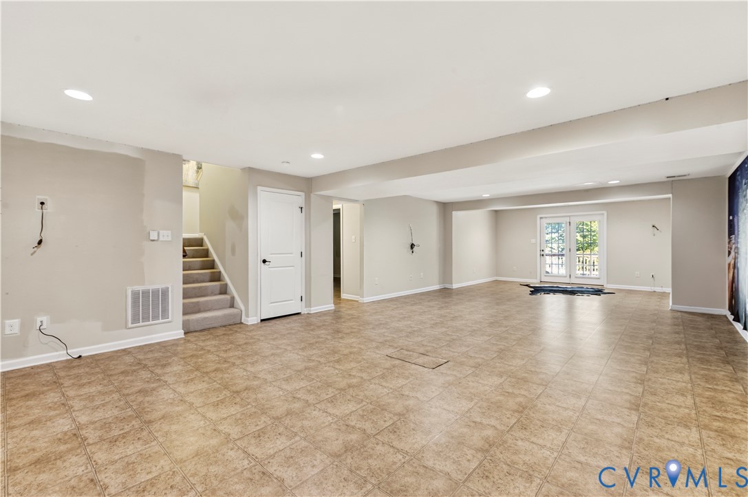 Above Ground - Walk Out Basement is Incredible!  Full Bath + Craft Room + Theatre Room and Expansive All Purpose Room with French Doors Leading to a Lower Deck