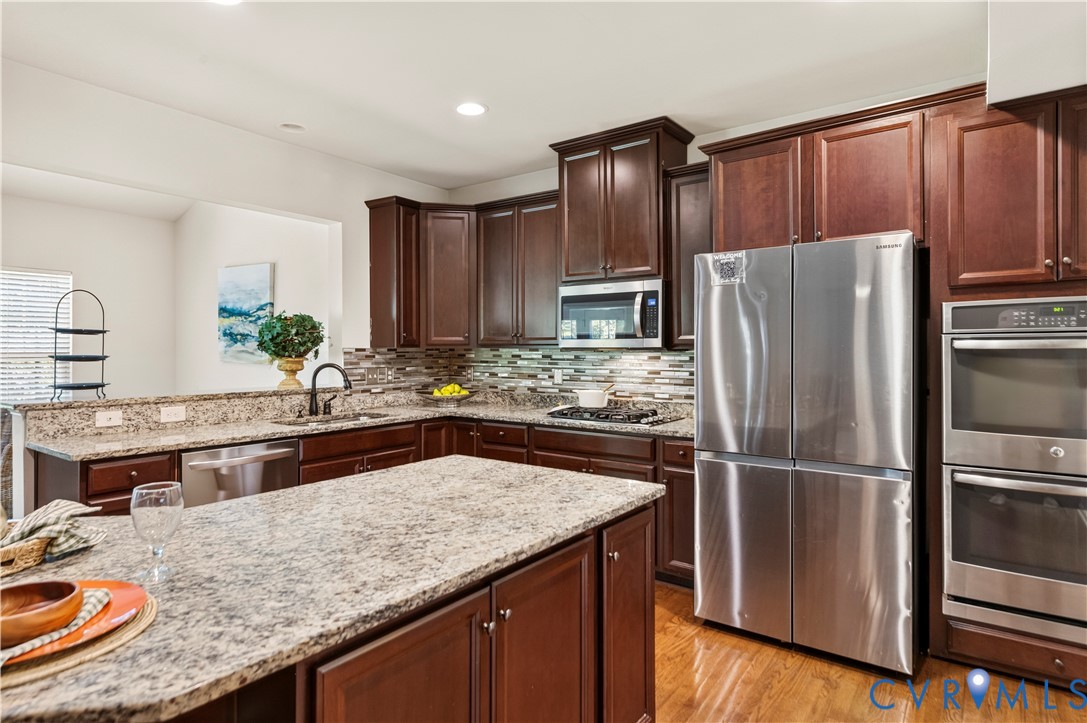 A Kitchen Island that provides a Great Workspace without missing out on all the First Floor Action!