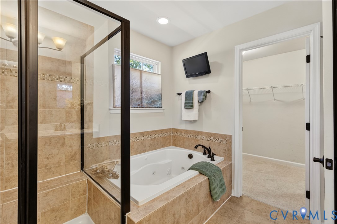 Soaker Tub with Jets & Large Tiled Shower is a Home Run!