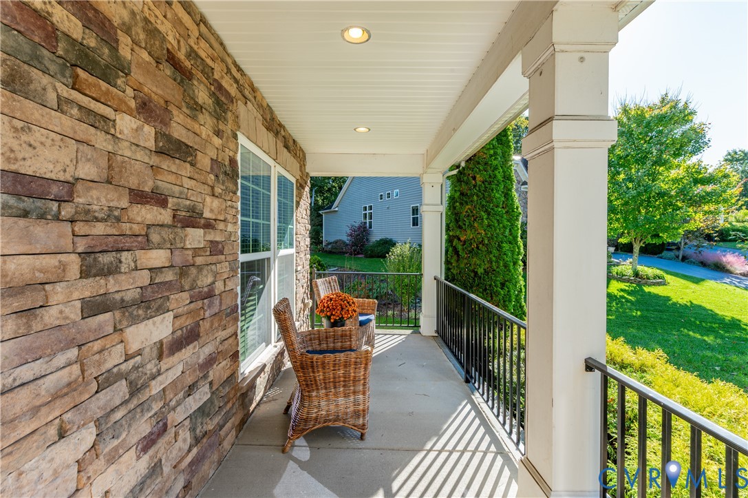 A Stacked-Stone Porch is a Perk while Looking out over the Culdesac