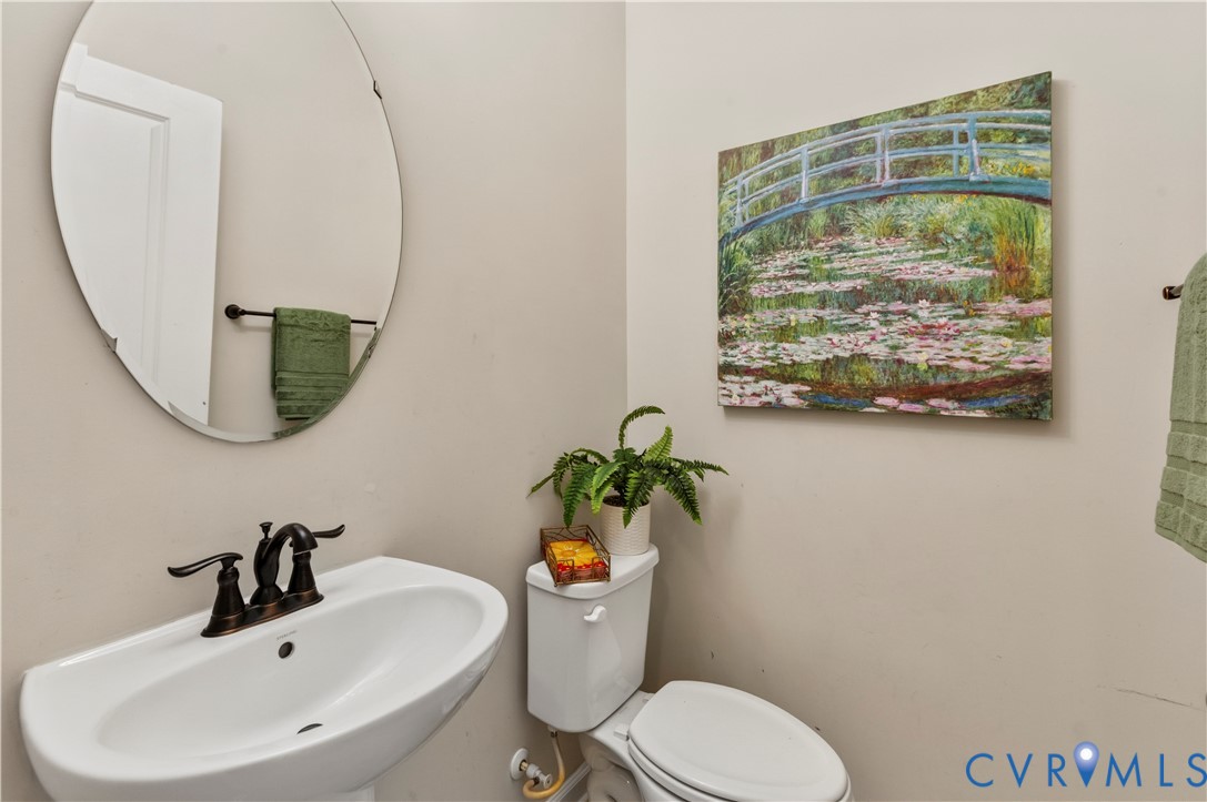 Powder Bath with Pedestal Sink located in Hallway