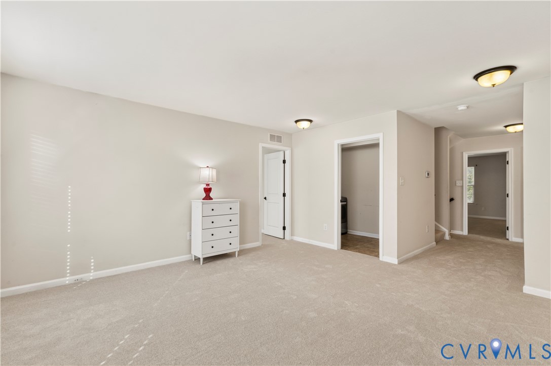 All Purpose Space with 2 Additional Bedrooms - Laundry Room + Primary Suite and stairs to 3rd Level