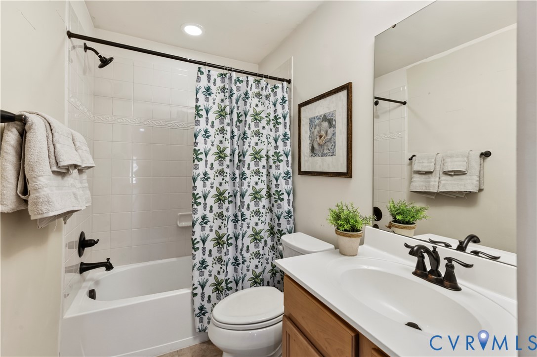 Lower Level Full Bath has Tiled Floors and Tiled Shower Surround