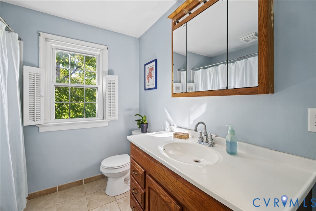 Full Bath with tile floors
