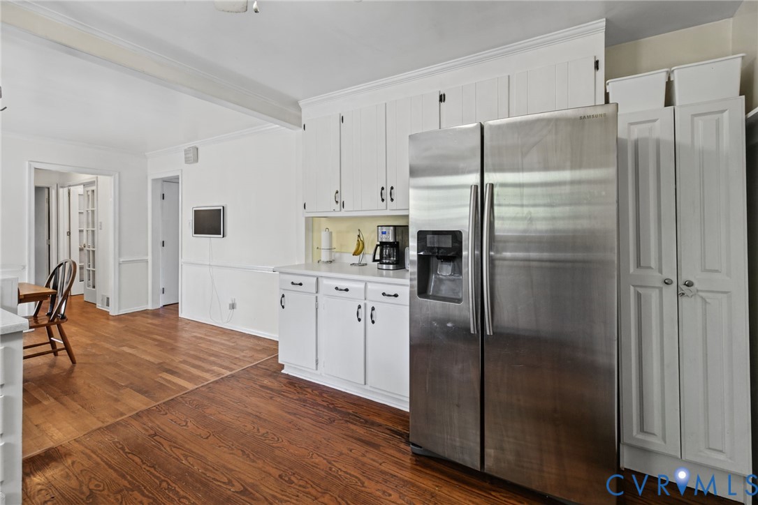 Open to dining area, cabinetry, stainless Fridge