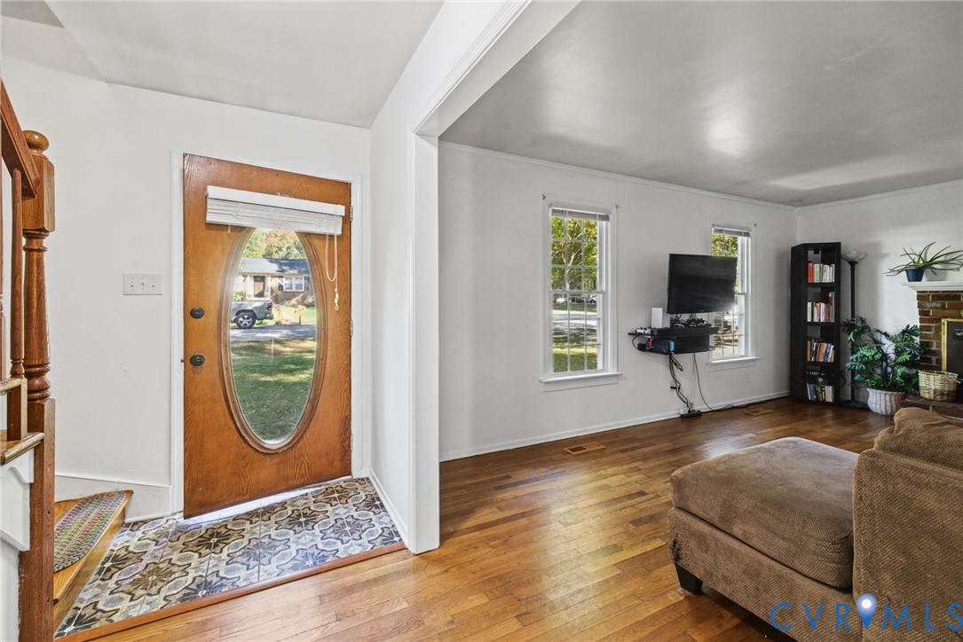 Foyer and hardwood stairs