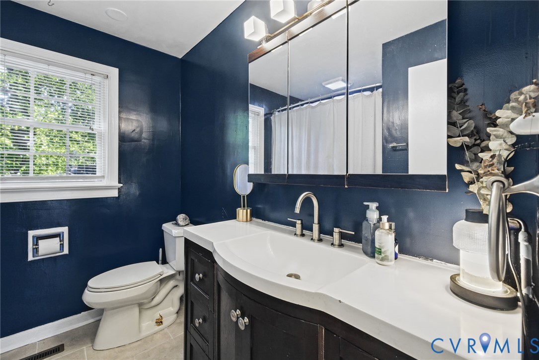 Full bathroom with tile floors