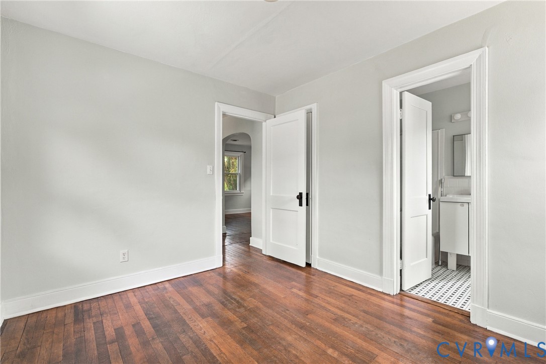 Wood-finish flooring with white trim Wood-finish flooring with white trim