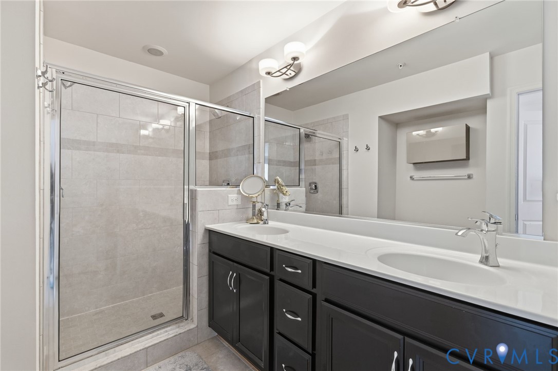 Dual vanity with integrated sinks and chrome fixtures
