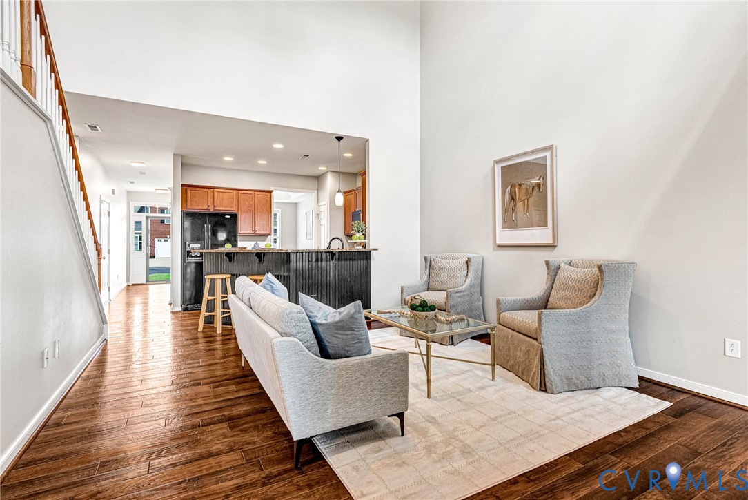 High ceilings complement the rich wood-finish flooring