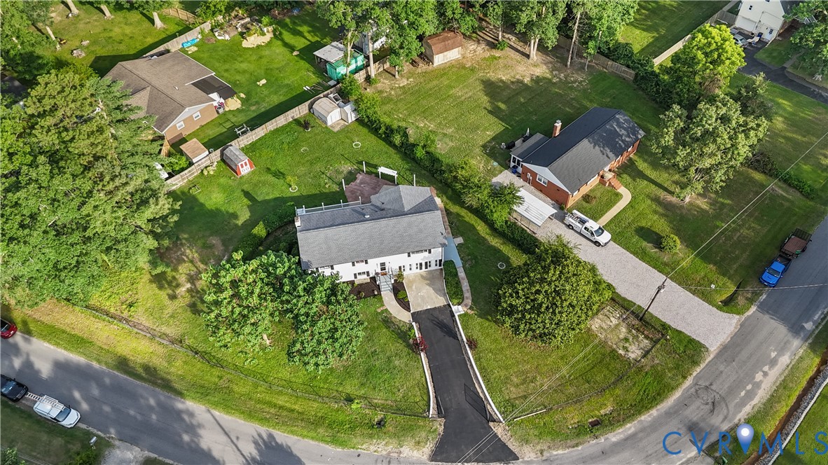Expansive parcel featuring multiple residential structures and mature trees Expansive parcel featuring multiple residential structures and mature trees