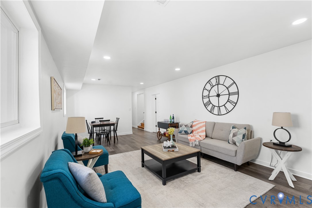 Recessed lighting, wood-finish flooring, white walls, and bright windows