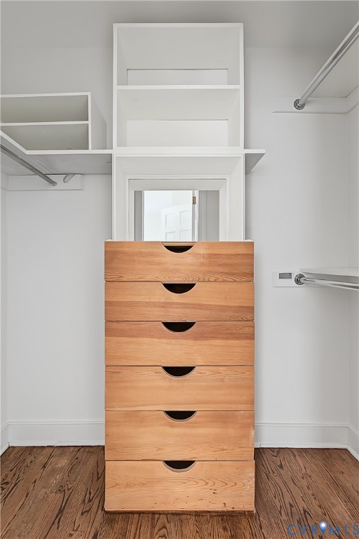 Primary bedroom walk in closet