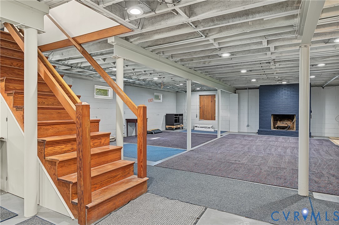 Large unfinished basement with fireplace