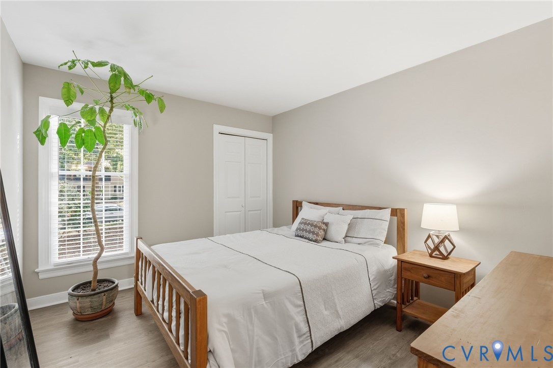 Main-level secondary bedroom with ample natural light and closet space