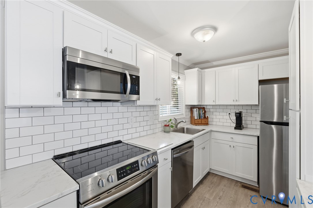Featuring newer stainless steel appliances (2024)