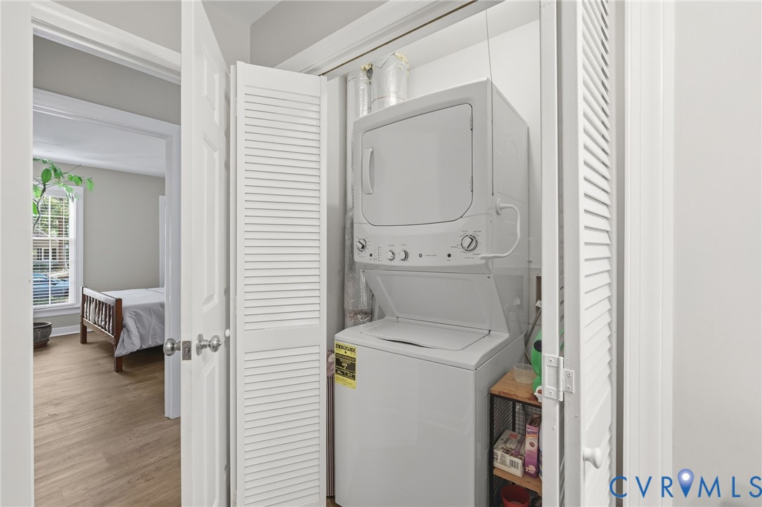 Main-level laundry area with stacked washer/dryer (2024)