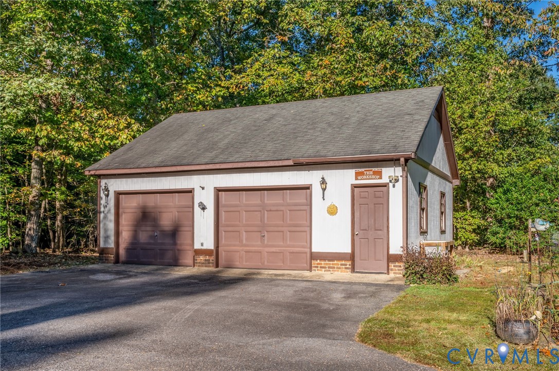 over sized detached garage/workshop with potting sink on the side.