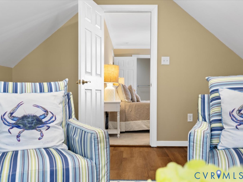 Hardwood flooring with a white paneled door