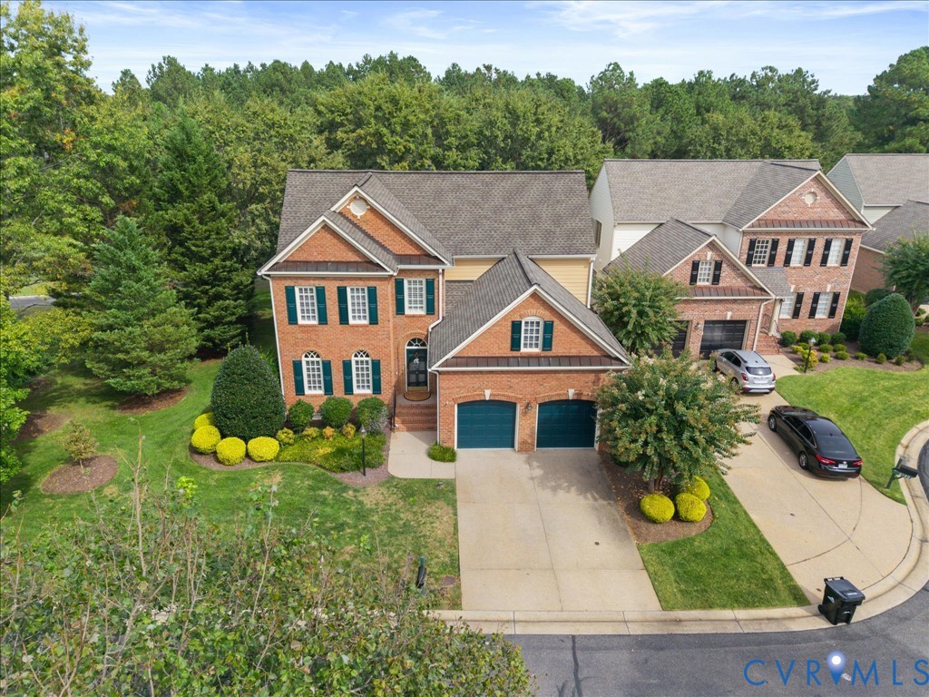 Brick exterior with a gabled roof and a two-car garage Brick exterior with a gabled roof and a two-car garage
