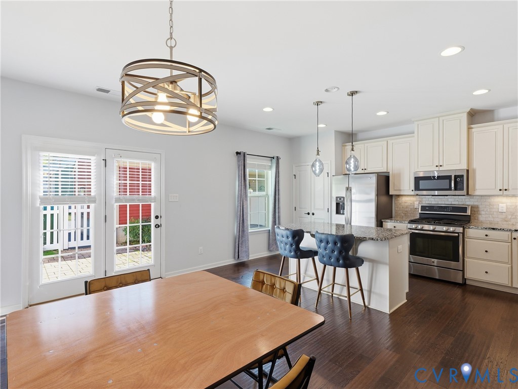 Enjoy casual meals on the center kitchen island or host larger gatherings in the adjoining dining area.