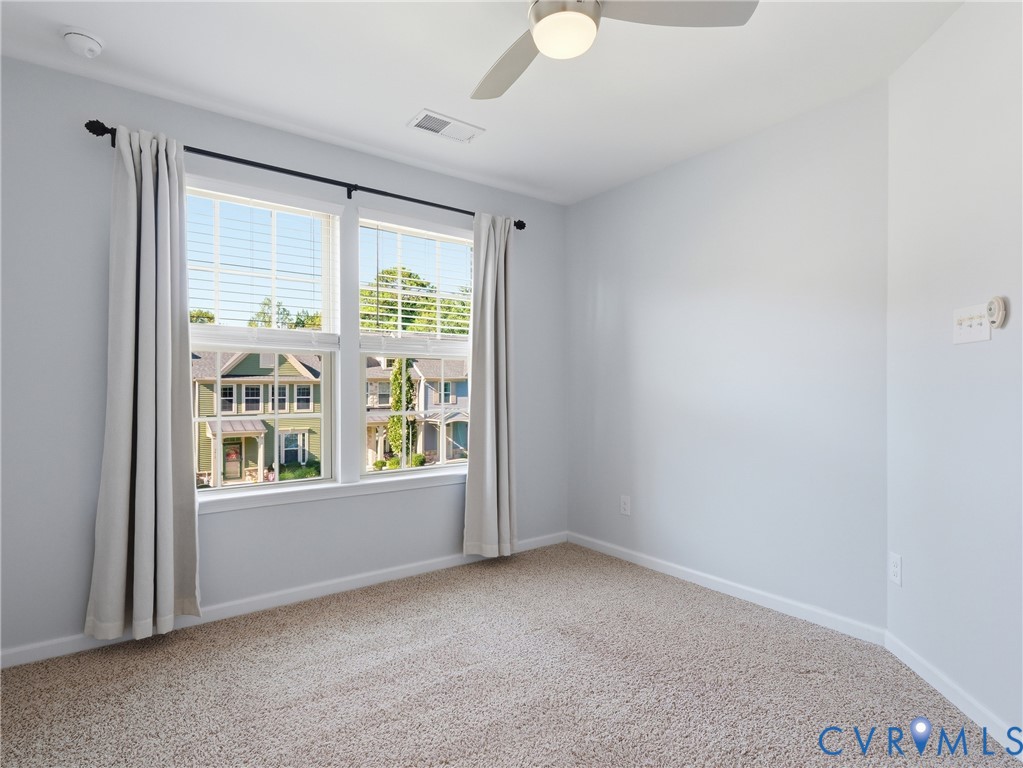Bright secondary bedroom with a comfortable layout for family or guests