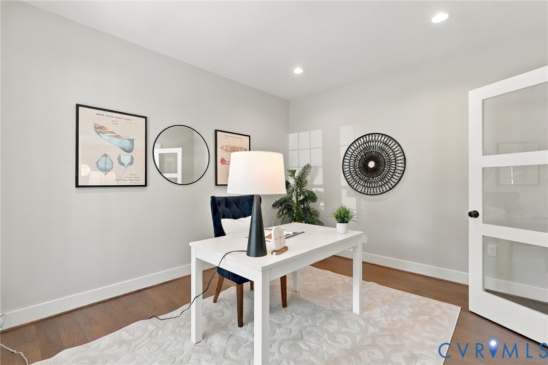 The Study has Recessed Lighting & Wood Floors
