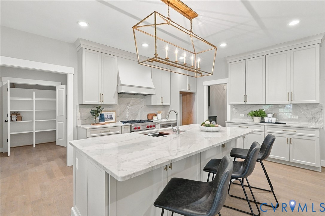 The Kitchen Pantry (look close) has Wood Shelves & Double Doors